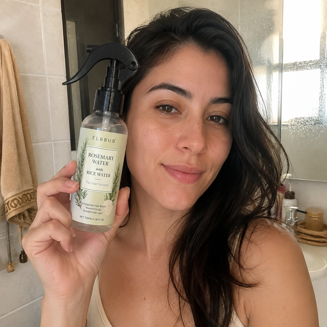 Woman holding a bottle of Fabreze Revitalizing Water in a bathroom setting